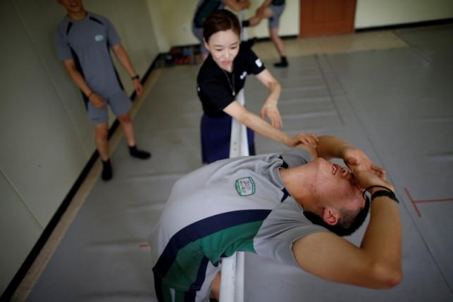 The Wider Image: Ballet classes for soldiers in South Korea